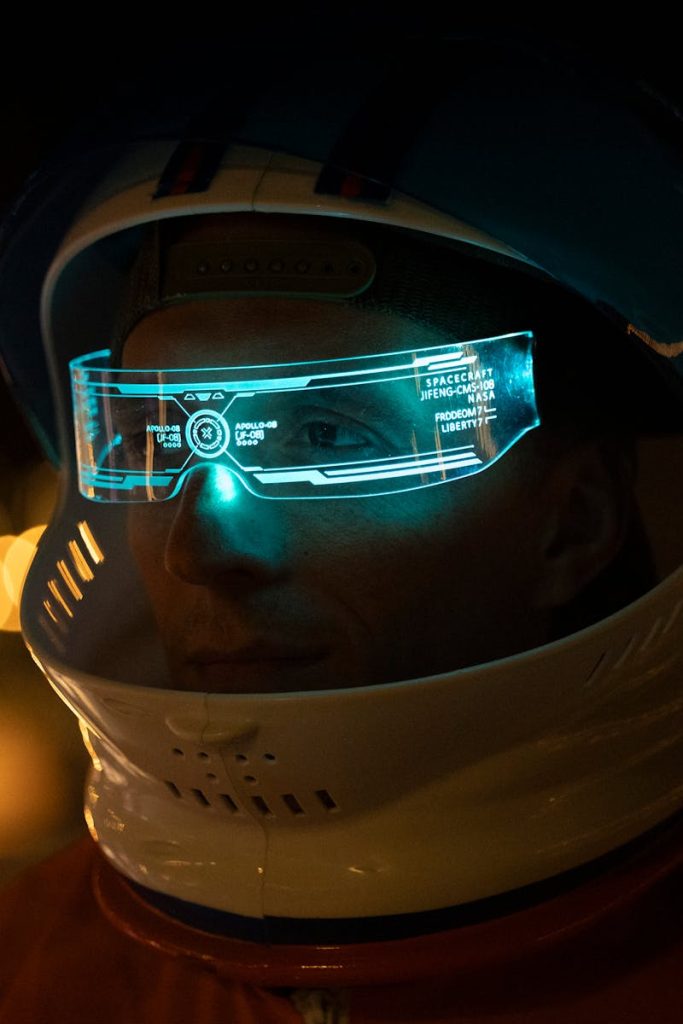 A close-up of a futuristic astronaut helmet featuring a holographic display, creating a sci-fi ambiance.